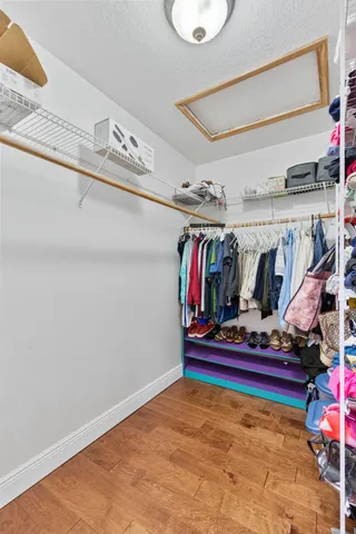 a bathroom with a tub a sink and a window