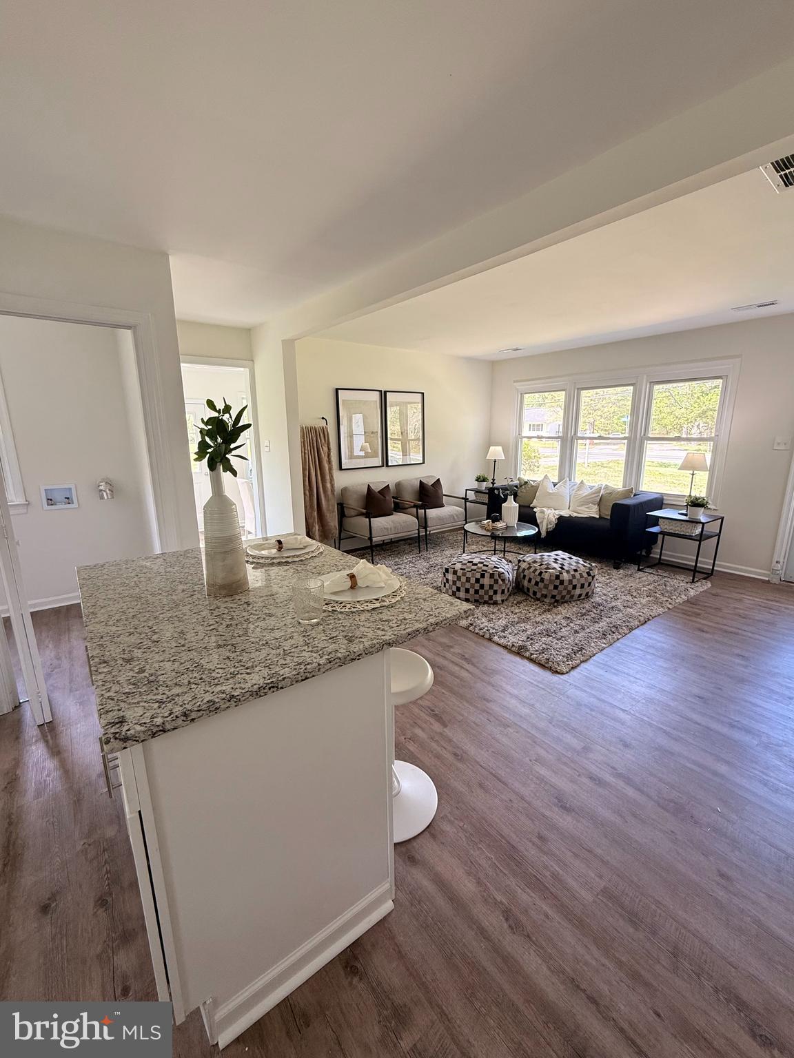 5839 Shady Side Road Churchton, MD 20733 - Photo 2 of 5 a living room with granite countertop furniture and a couch
