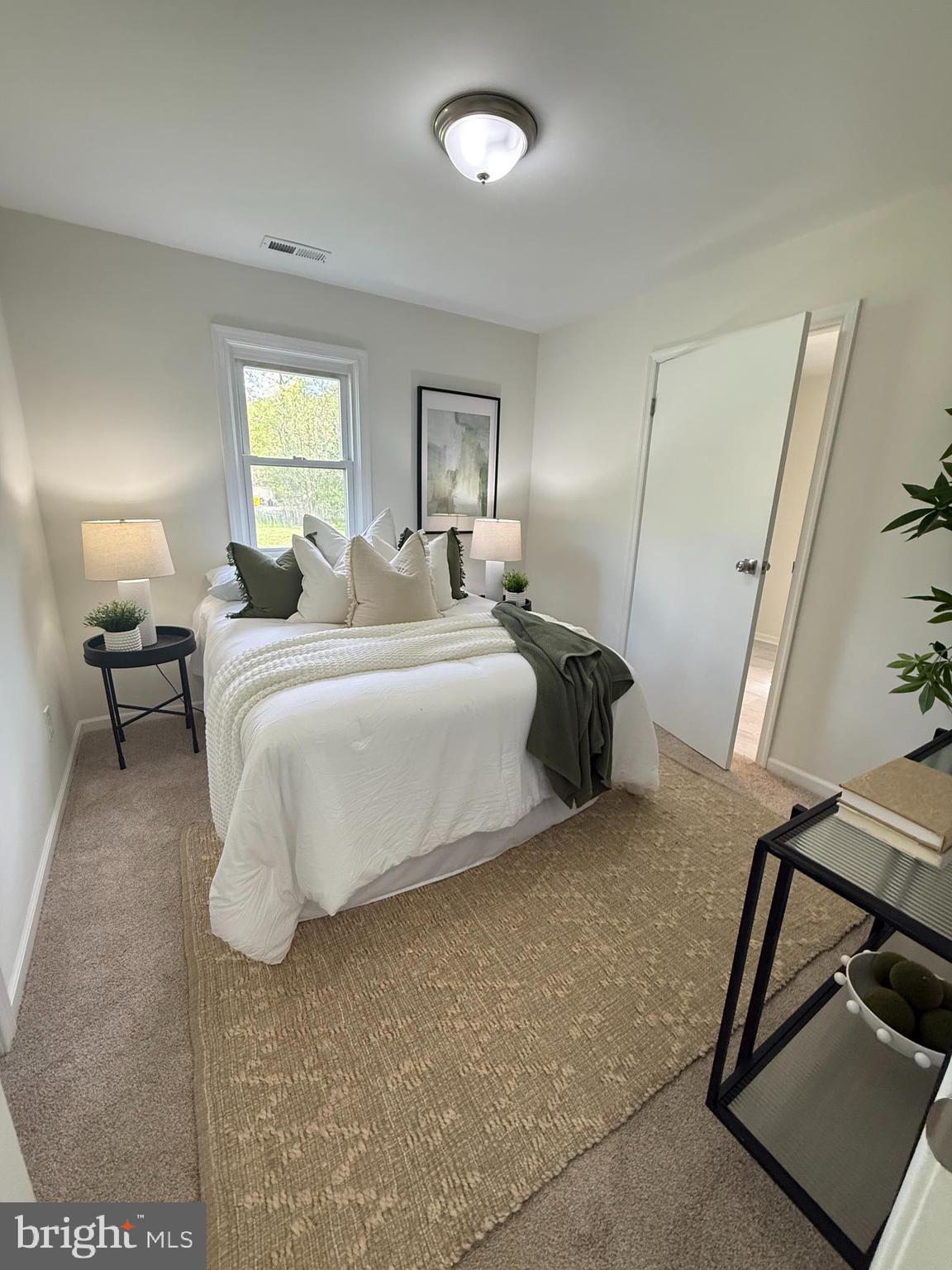 5839 Shady Side Road Churchton, MD 20733 - Photo 4 of 5 a bedroom with a bed and a window