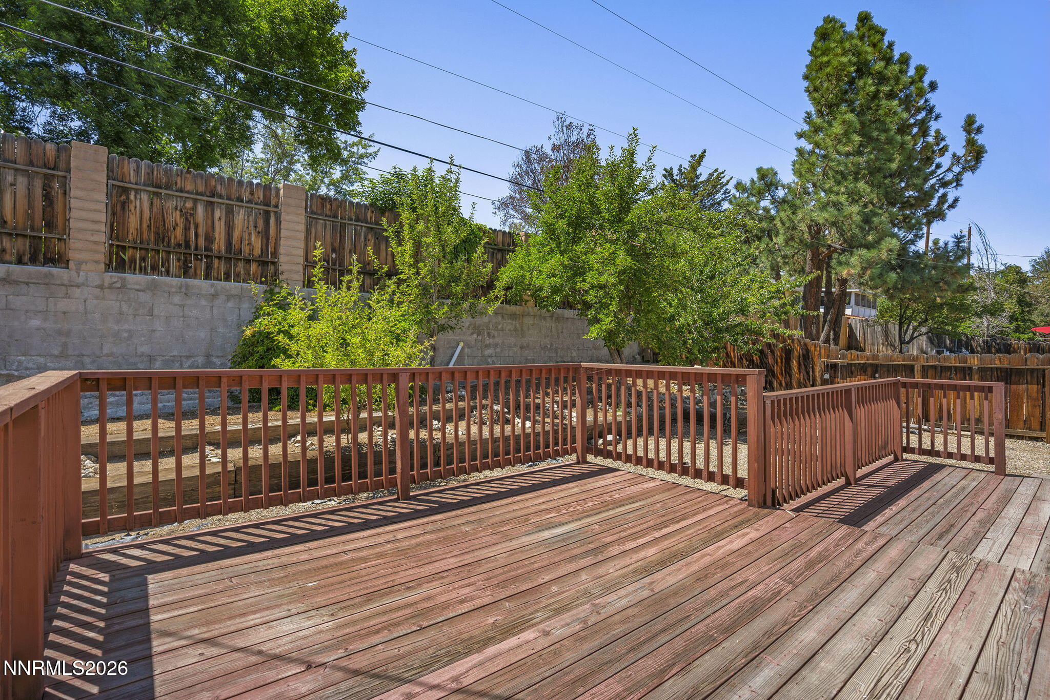 1401 Surf Way Reno, NV 89503 - Photo 25 of 33 a view of deck with wooden fence and trees