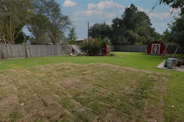 a view of a backyard with green space