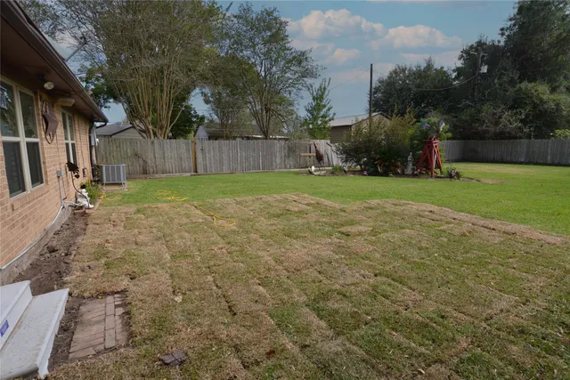 a backyard of a house with lots of green space