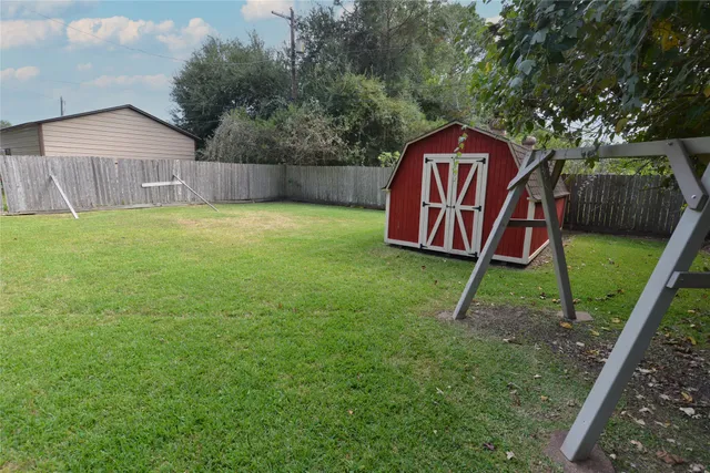 a backyard of a house with lots of green space