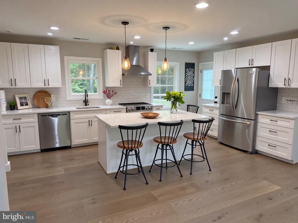 a kitchen with stainless steel appliances a table chairs refrigerator and a sink