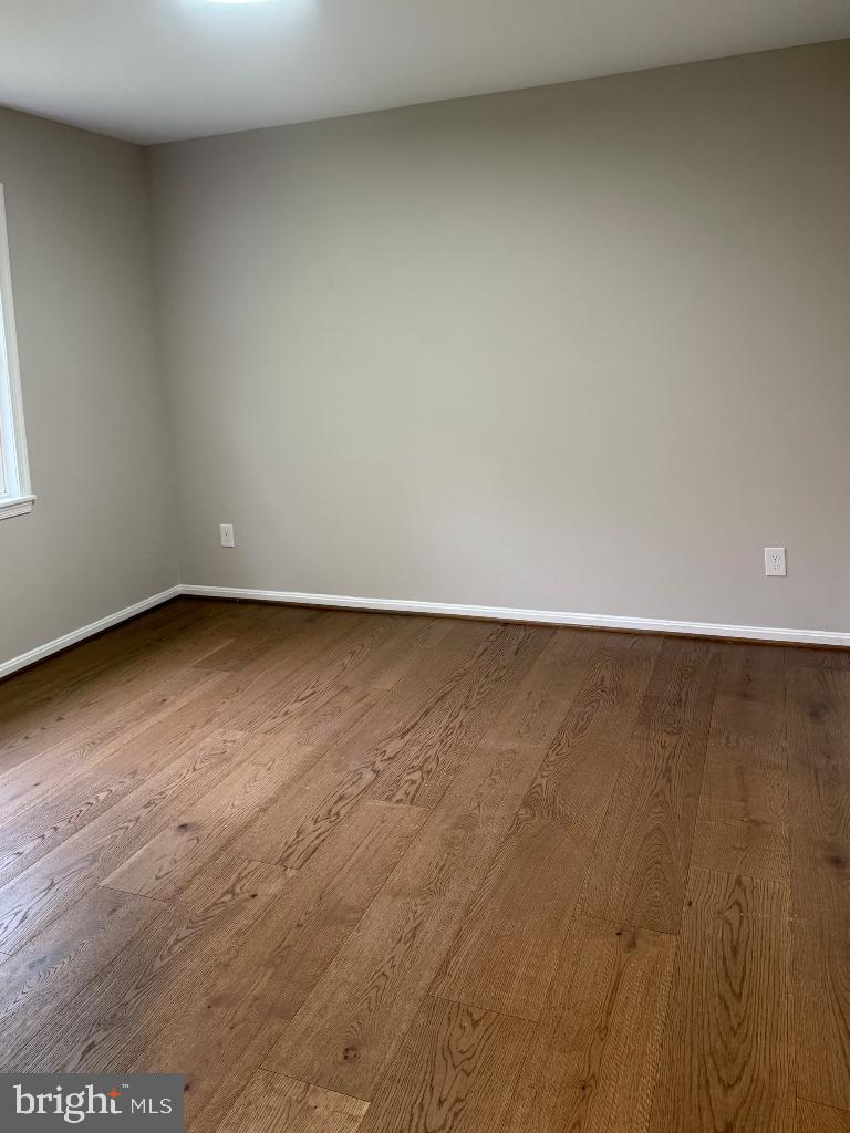 12713 Foxtrot Road Bealeton, VA 22712 - Photo 12 of 19 a view of an empty room with wooden floor