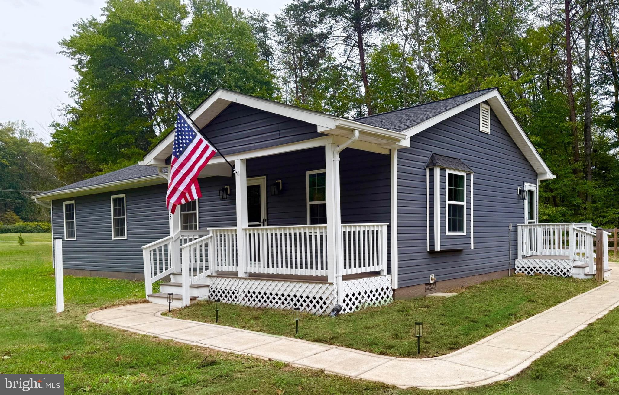 12713 Foxtrot Road Bealeton, VA 22712 - Photo 3 of 19 a front view of a house with a garden