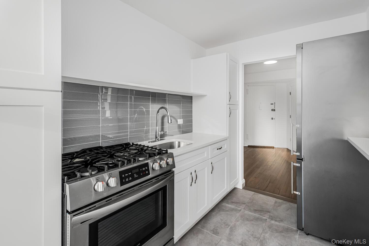 4320 Van Cortlandt Park East, Unit 5A Bronx, NY 10470 - Photo 4 of 15 Renovated Kitchen with New Cabinetry and Stainless Steel appliances.