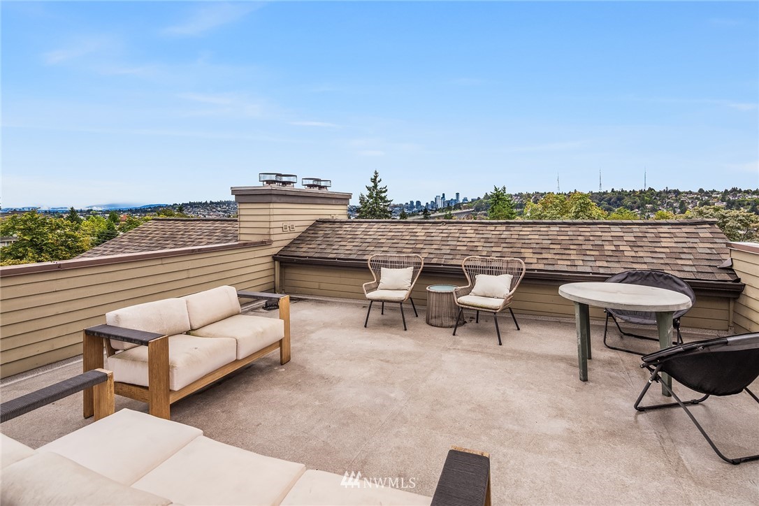 3901 Fremont Avenue North, Unit 206 Seattle, WA 98103 - Photo 12 of 15 a view of a terrace with furniture