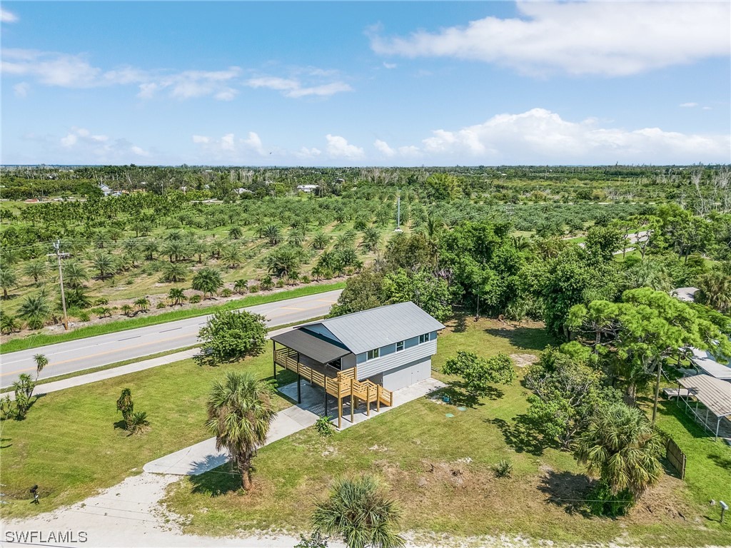 14230 Robert Road Bokeelia, FL 33922 - Photo 20 of 22 a view of a yard with an outdoor space