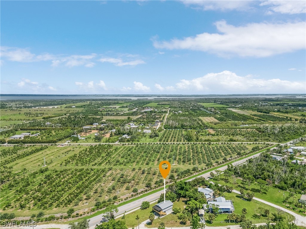 14230 Robert Road Bokeelia, FL 33922 - Photo 21 of 22 a view of an ocean and a yard