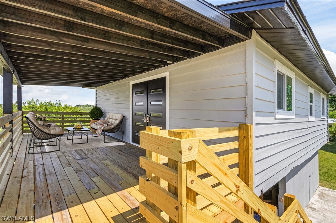 14230 Robert Road Bokeelia, FL 33922 - Photo 4 of 22 a view of porch with seating space