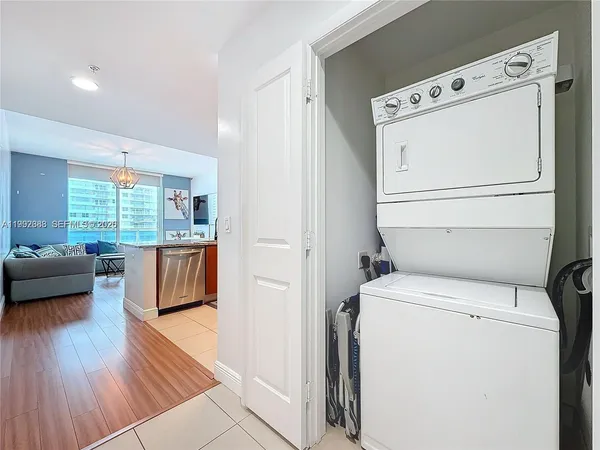 a view of washer and dryer with wooden floor