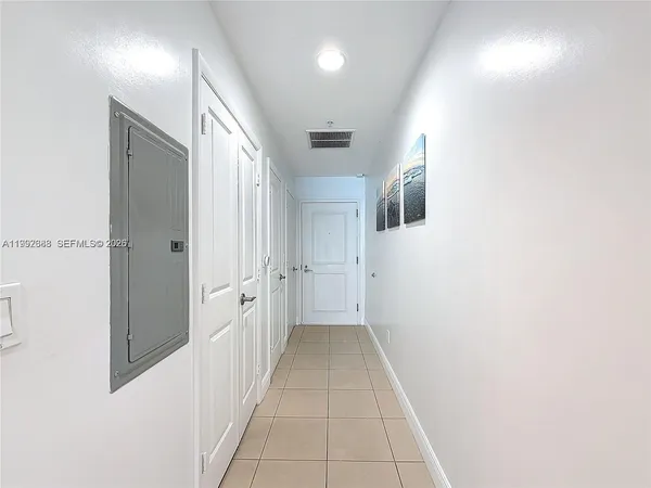 a hallway with white doors