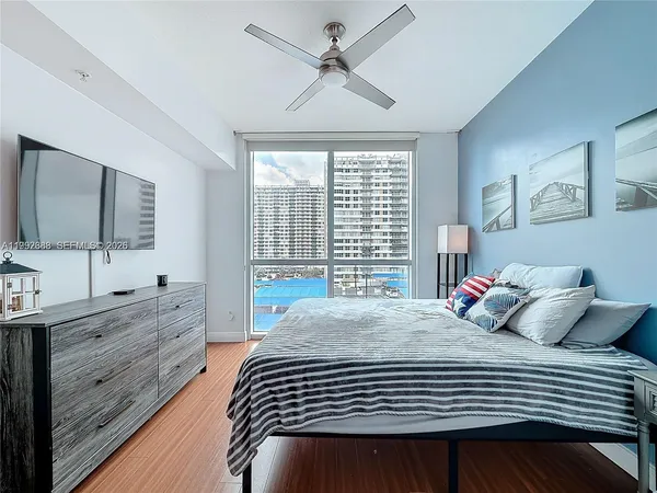 a bedroom with a bed and a dresser