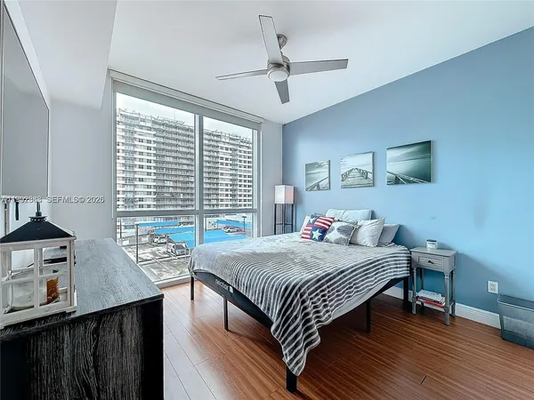 a bedroom with a bed and a table in it