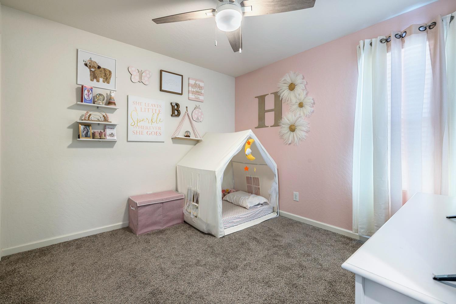 3780 Highclere Way Clovis, CA 93619 - Photo 12 of 21 a living room with furniture and a chandelier