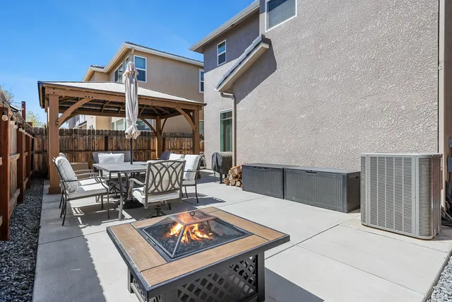 a outdoor space with patio furniture and potted plants