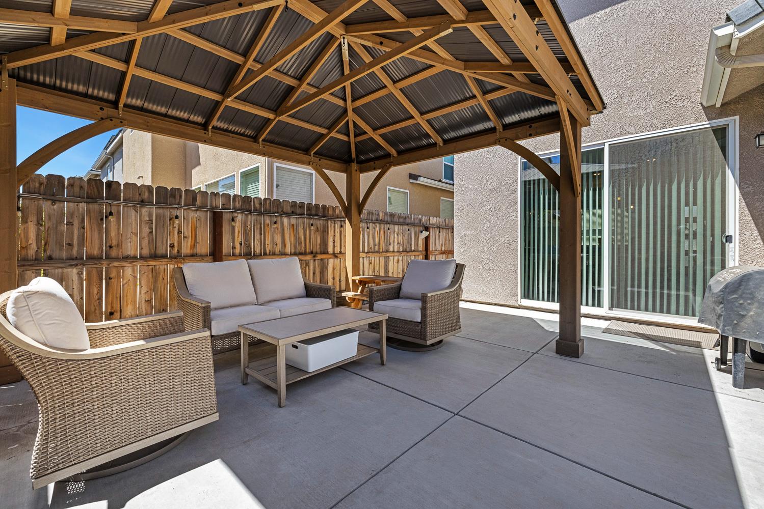 3780 Highclere Way Clovis, CA 93619 - Photo 19 of 21 a outdoor space with patio furniture and potted plants