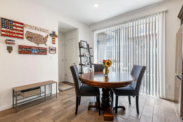 a view of a dining room with furniture and window