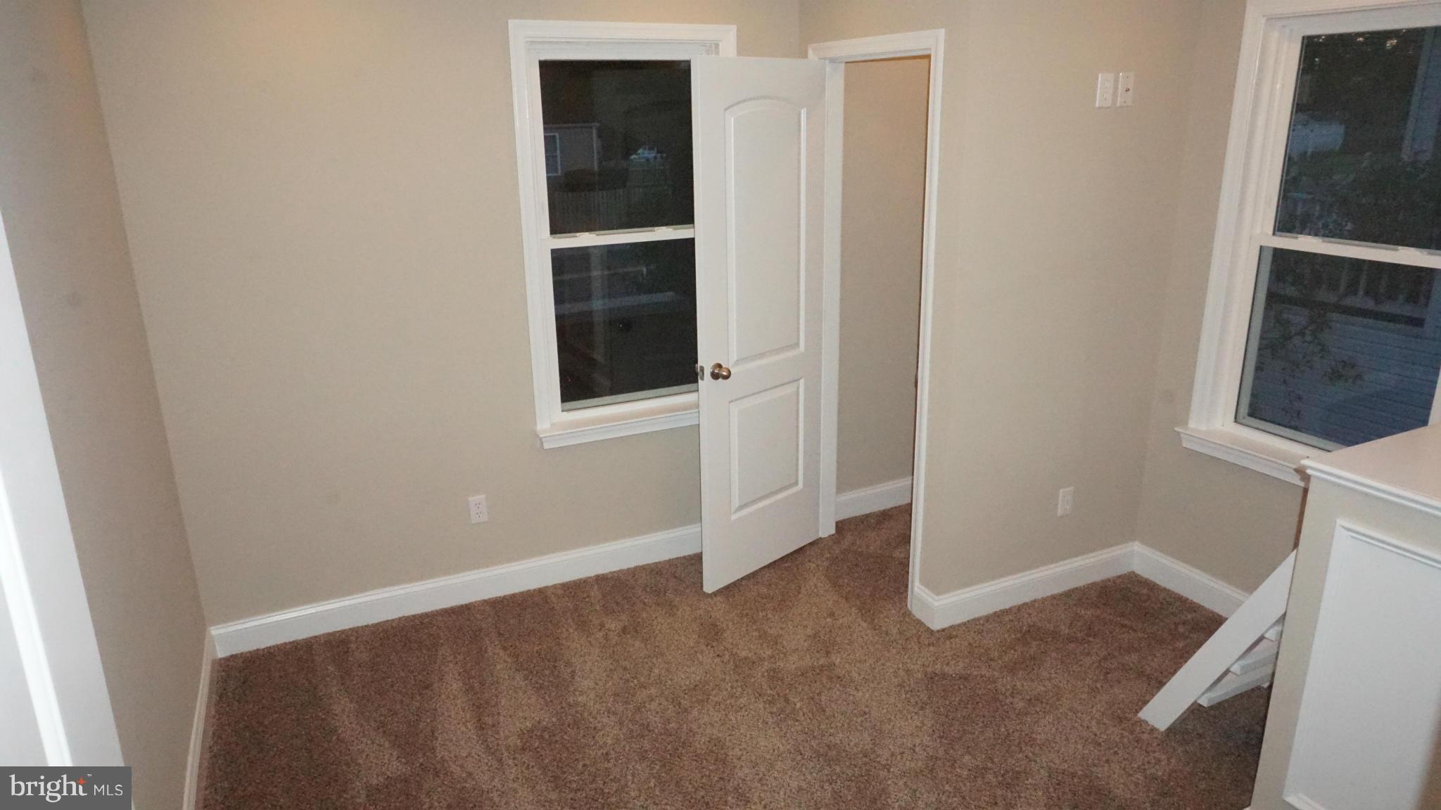 6922 Sollers Point Road Baltimore, MD 21222 - Photo 16 of 30 an empty room with windows