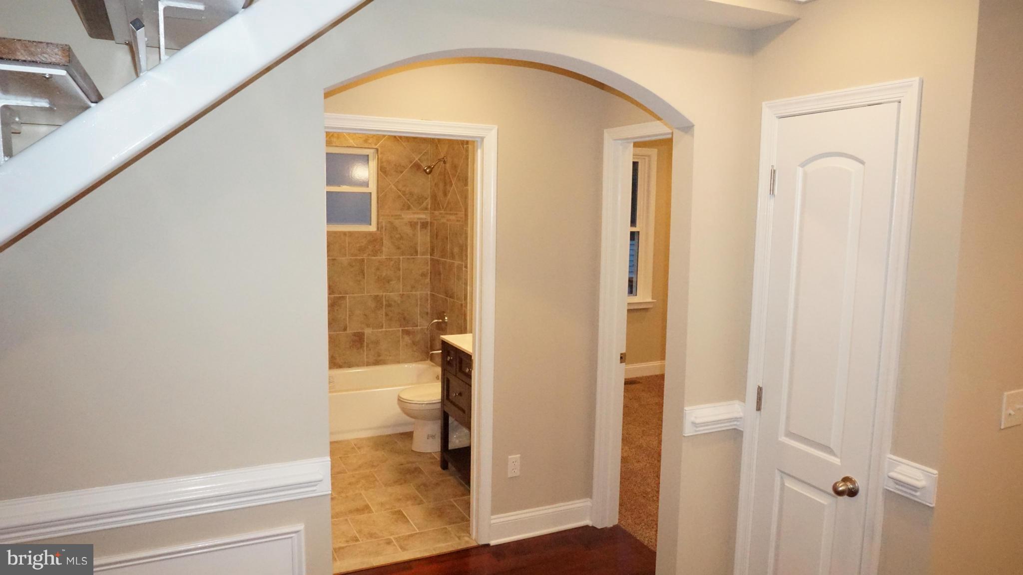 6922 Sollers Point Road Baltimore, MD 21222 - Photo 19 of 30 a view of livingroom with hallway