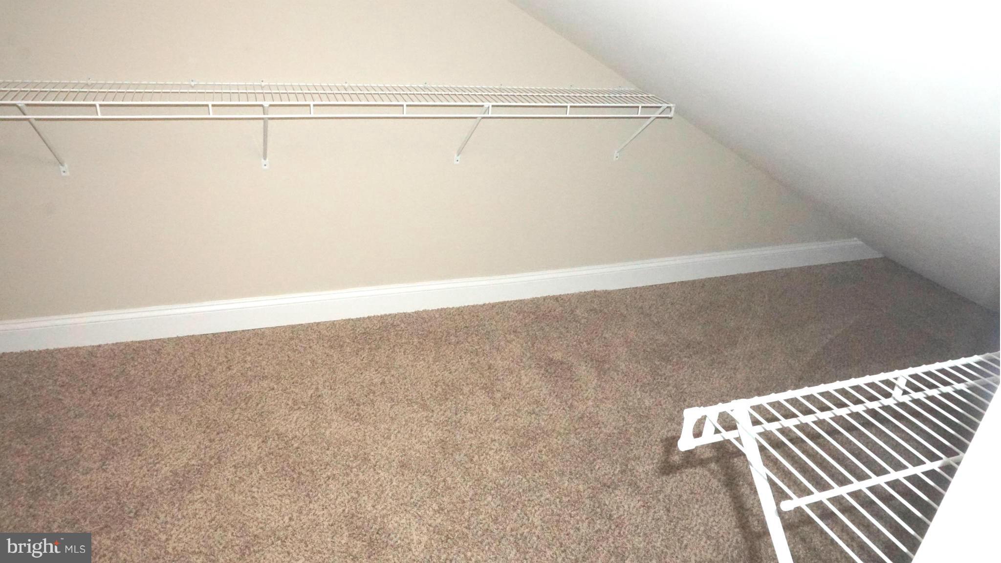 6922 Sollers Point Road Baltimore, MD 21222 - Photo 23 of 30 a view of a room with racks on the wall