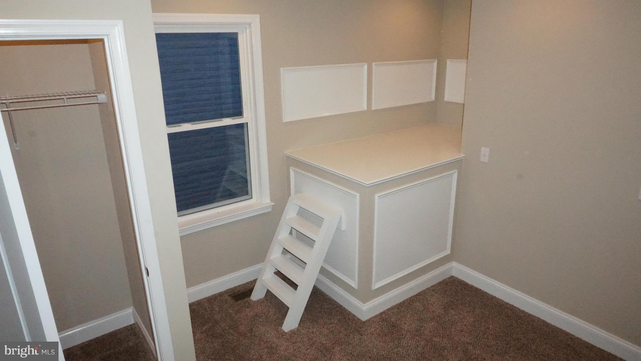 6922 Sollers Point Road Baltimore, MD 21222 - Photo 10 of 30 a view of an empty room with wooden floor
