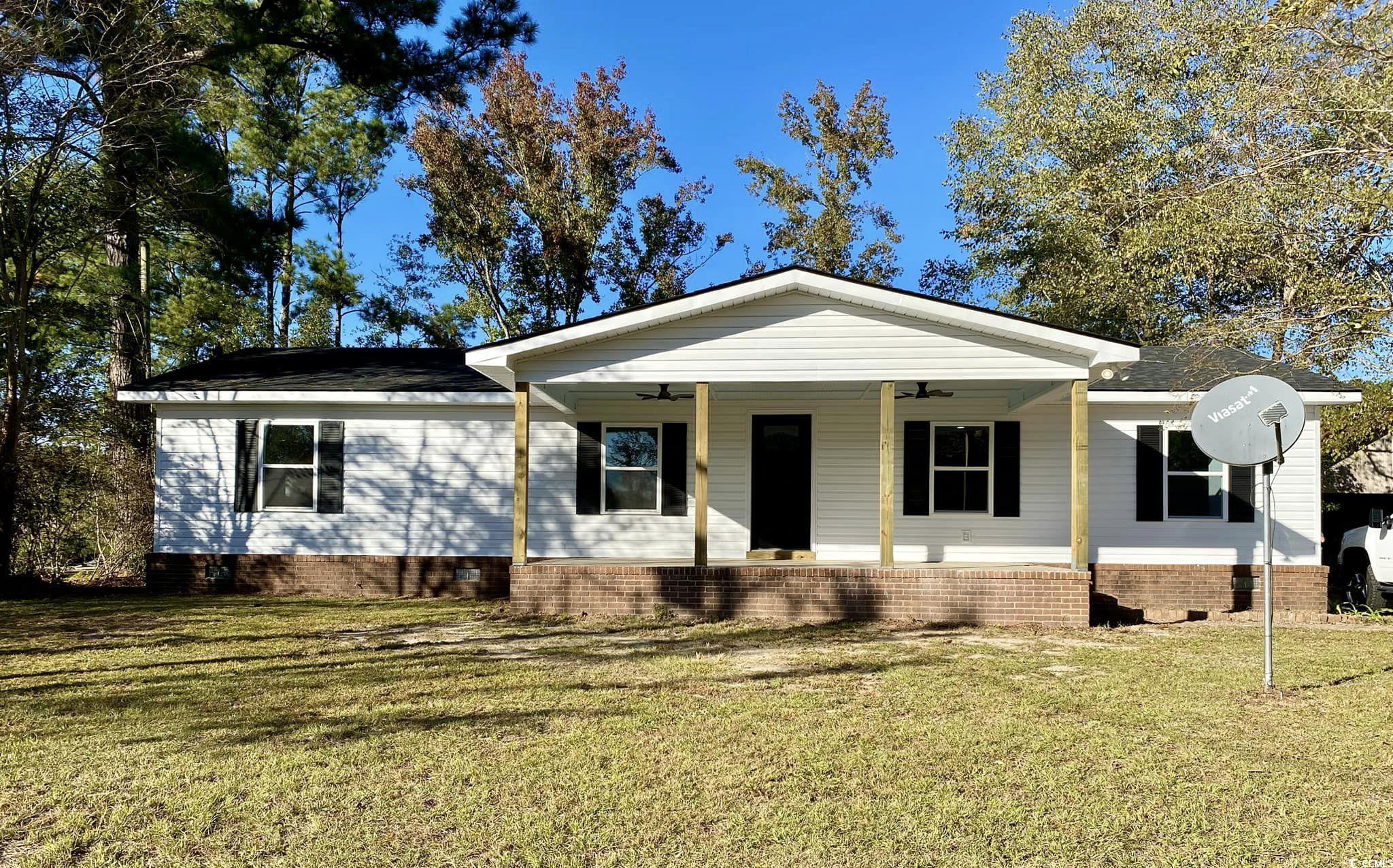 1044 Levi Street Manning, SC 29102 - Photo 1 of 26 View of front of property with a front yard and ceiling fan