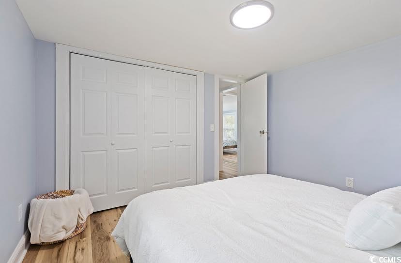 1044 Levi Street Manning, SC 29102 - Photo 13 of 26 Bedroom featuring light wood-style flooring, a closet, and baseboards