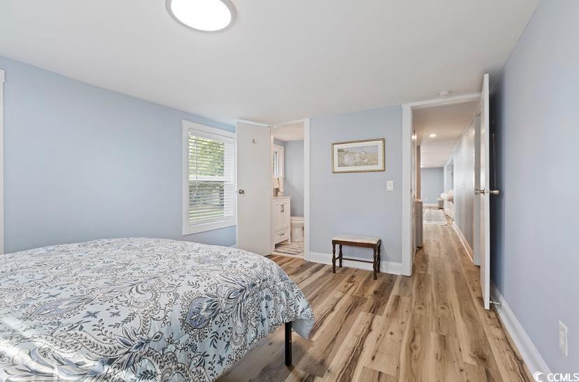1044 Levi Street Manning, SC 29102 - Photo 15 of 26 Bedroom with light wood-type flooring, baseboards, and ensuite bathroom