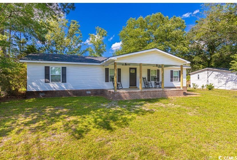 1044 Levi Street Manning, SC 29102 - Photo 2 of 26 Ranch-style home with ceiling fan, covered porch, a front yard, and crawl space