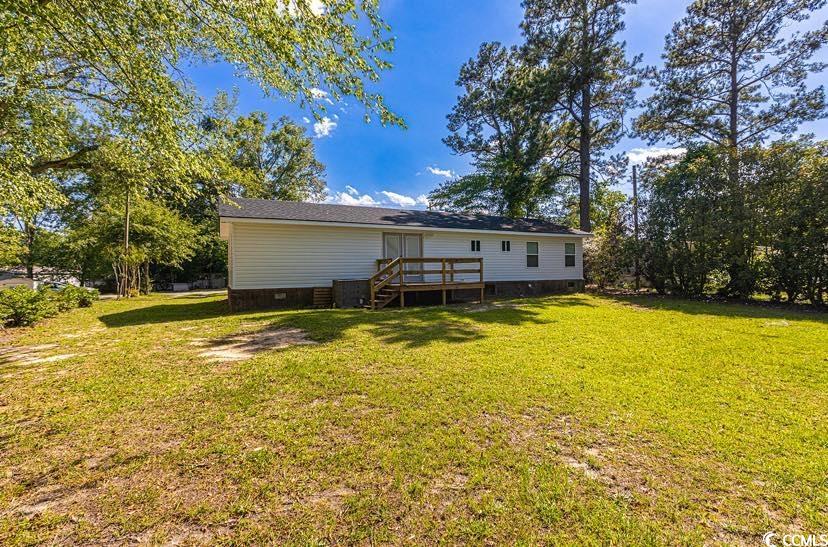 1044 Levi Street Manning, SC 29102 - Photo 3 of 26 Rear view of property featuring a wooden deck, a lawn, and crawl space