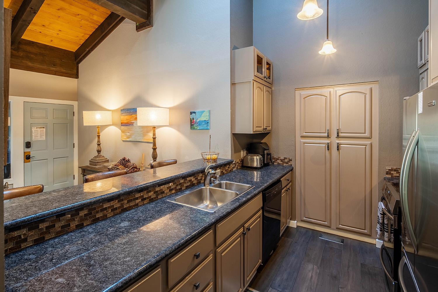 227 Olympic Vly Road, Unit 13 Olympic Valley, CA 96146 - Photo 11 of 28 a kitchen with stainless steel appliances granite countertop a sink stove and refrigerator