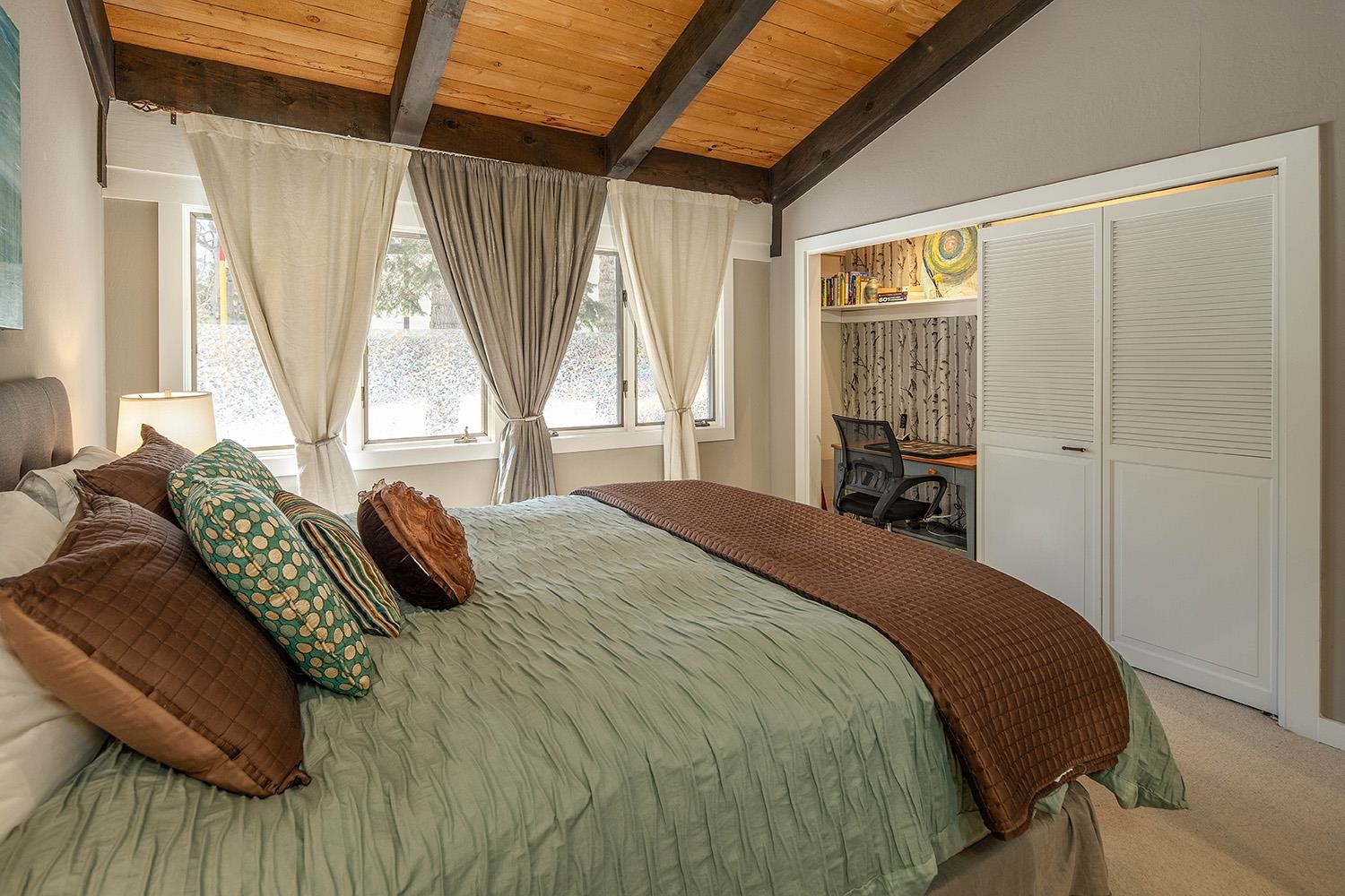 227 Olympic Vly Road, Unit 13 Olympic Valley, CA 96146 - Photo 14 of 28 a bedroom with a bed and a couch