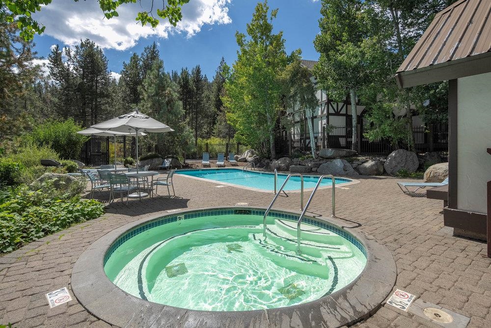 227 Olympic Vly Road, Unit 13 Olympic Valley, CA 96146 - Photo 23 of 28 a swimming pool with outdoor seating yard and barbeque oven