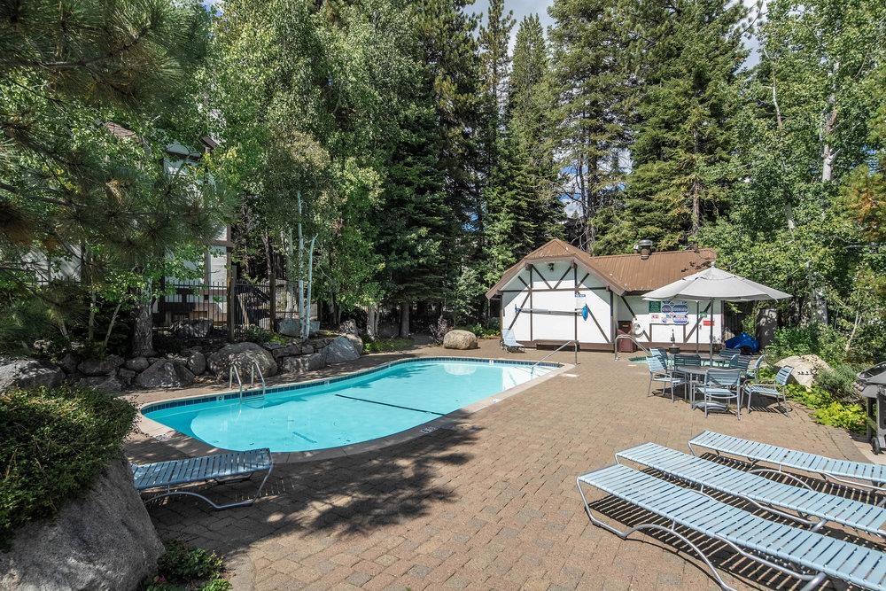 227 Olympic Vly Road, Unit 13 Olympic Valley, CA 96146 - Photo 24 of 28 a swimming pool with outdoor seating and yard