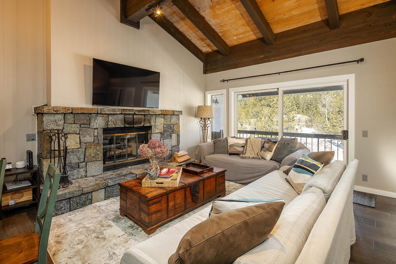 227 Olympic Vly Road, Unit 13 Olympic Valley, CA 96146 - Photo 7 of 28 a living room with furniture and a flat screen tv