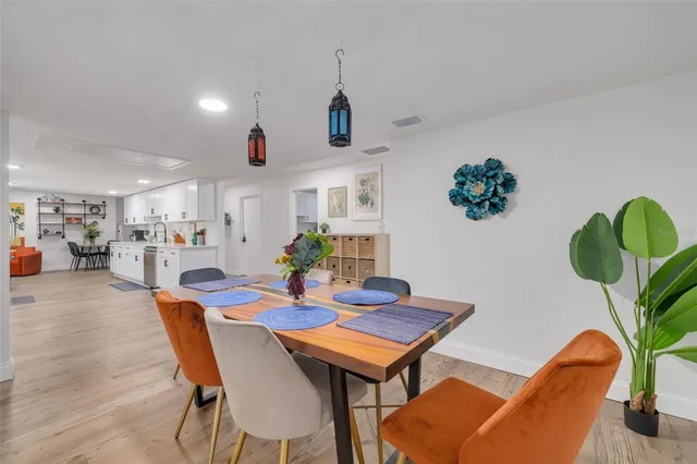 a kitchen with stainless steel appliances granite countertop refrigerator sink and cabinets