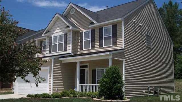 3545 Sunbright Lane Raleigh, NC 27610 - Photo 1 of 25 a front view of a house with plants