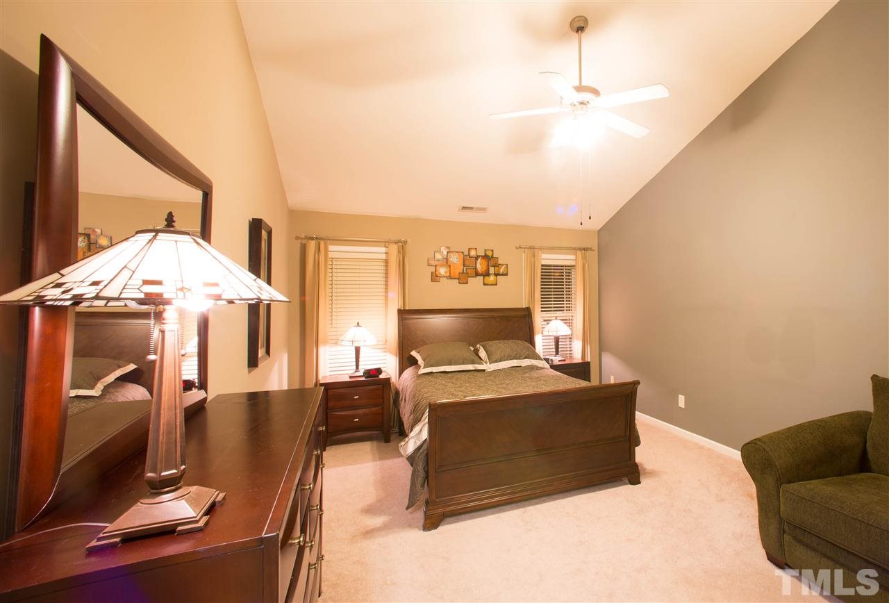 3545 Sunbright Lane Raleigh, NC 27610 - Photo 11 of 25 a living room with furniture and a chandelier