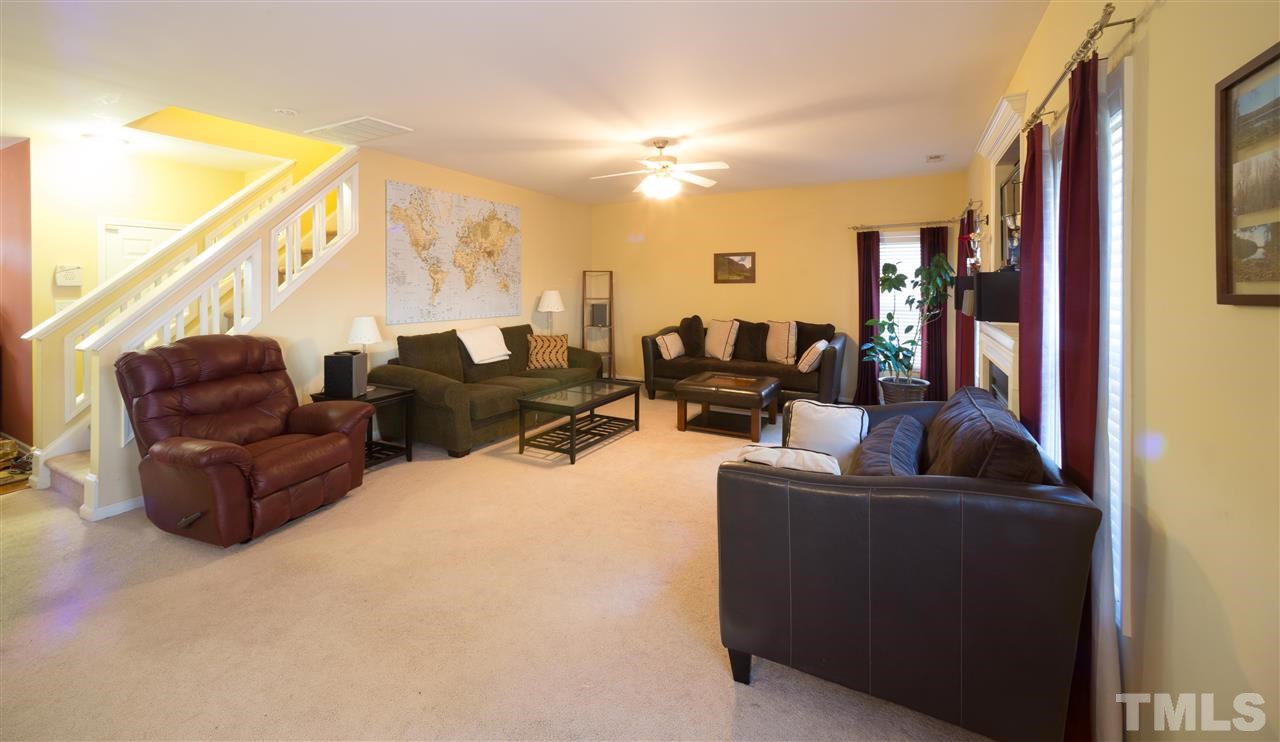 3545 Sunbright Lane Raleigh, NC 27610 - Photo 6 of 25 a living room with furniture and a large window