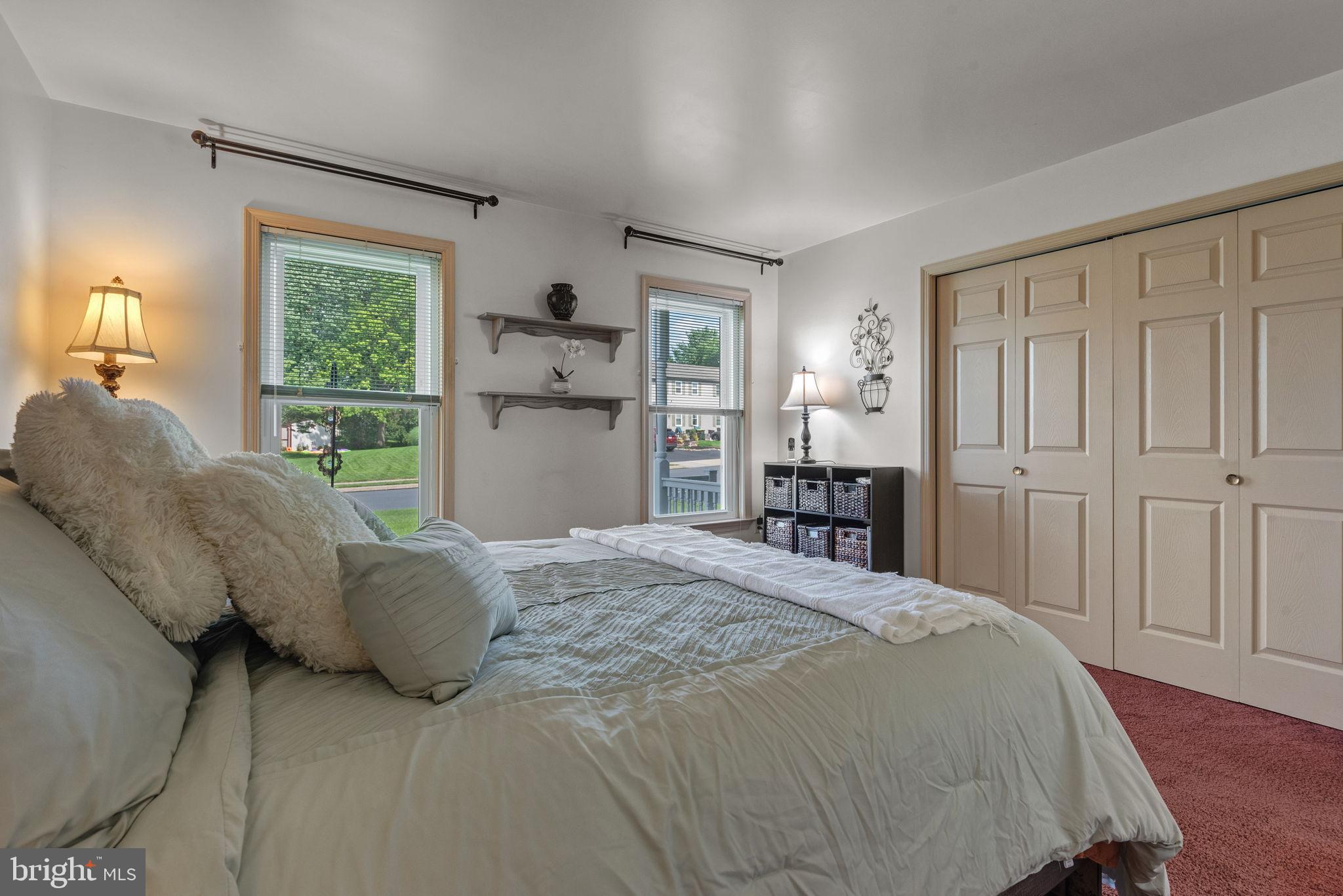65 Winding Way Lititz, PA 17543 - Photo 10 of 28 a bedroom with a large bed and a window