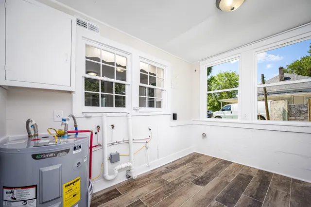 a view of kitchen with wooden floor and window