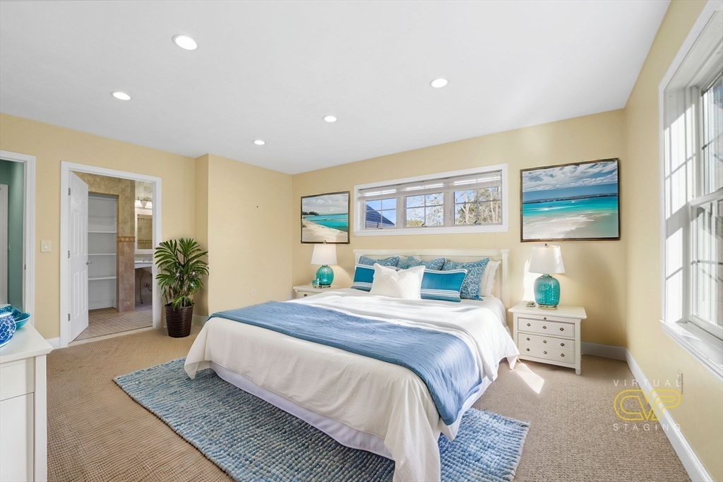 7 Cranberry Lane Wareham, MA 02538 - Photo 16 of 42 a bedroom with a large bed and a large window