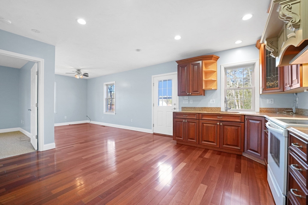 7 Cranberry Lane Wareham, MA 02538 - Photo 25 of 42 a kitchen with stainless steel appliances granite countertop wooden floors and sink