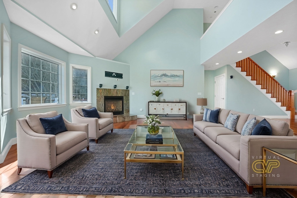 7 Cranberry Lane Wareham, MA 02538 - Photo 7 of 42 a living room with furniture and a fireplace