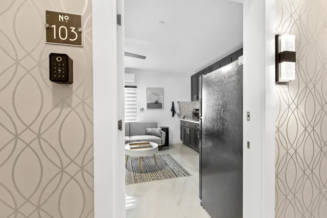 a bathroom with a toilet sink and shower