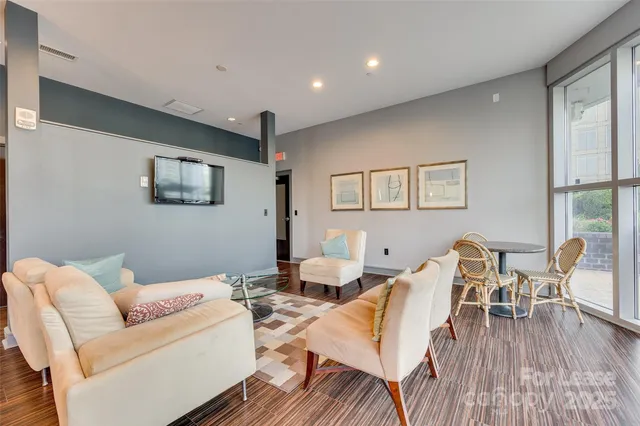 a view of a patio with dining table and chairs with potted plants