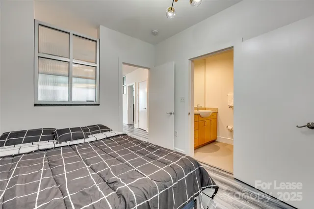a kitchen with a table chairs stove and refrigerator