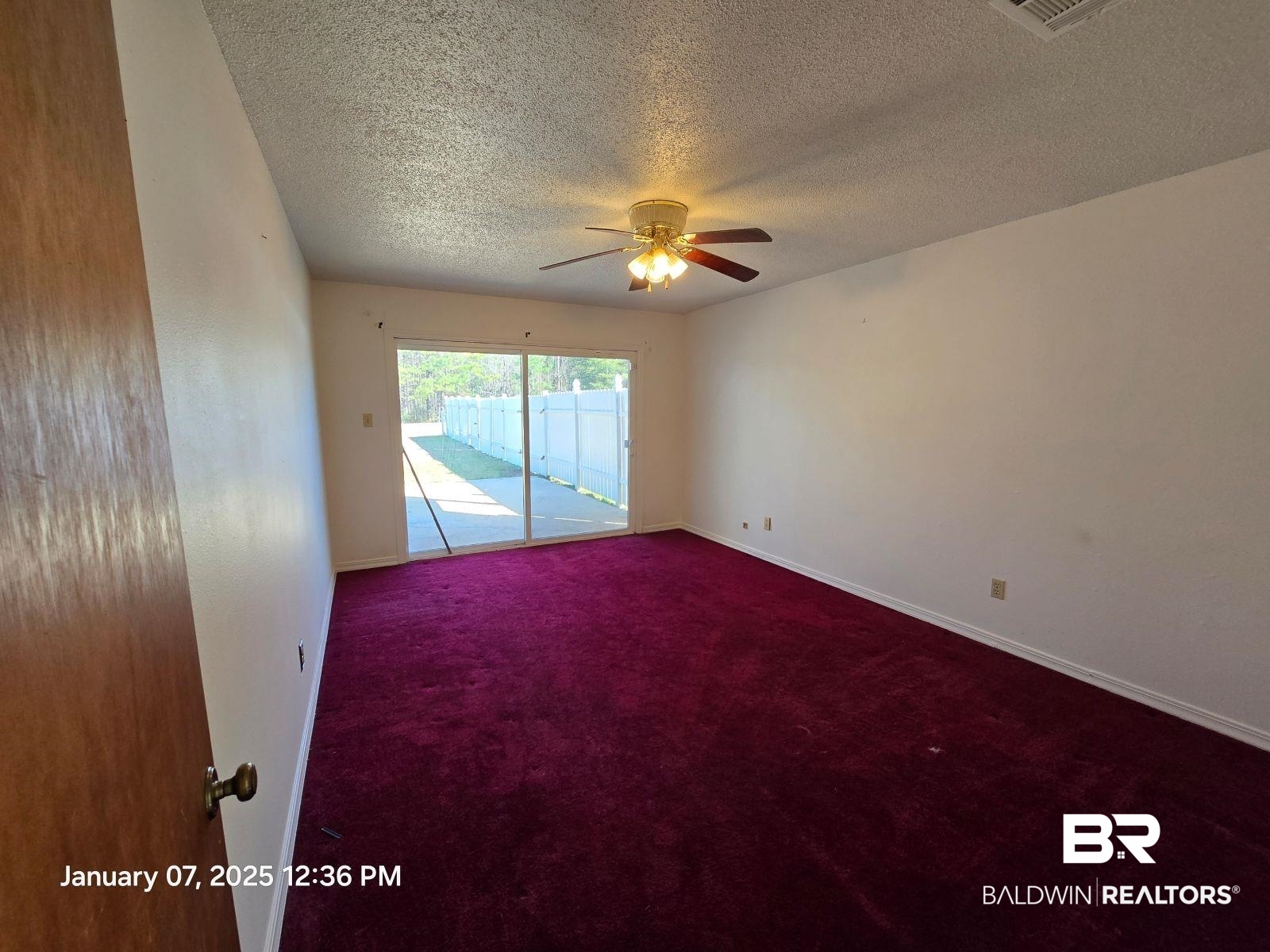 154 Byrd Road Monroeville, AL 36460 - Photo 16 of 26 Unfurnished room featuring carpet floors, a textured ceiling, and ceiling fan